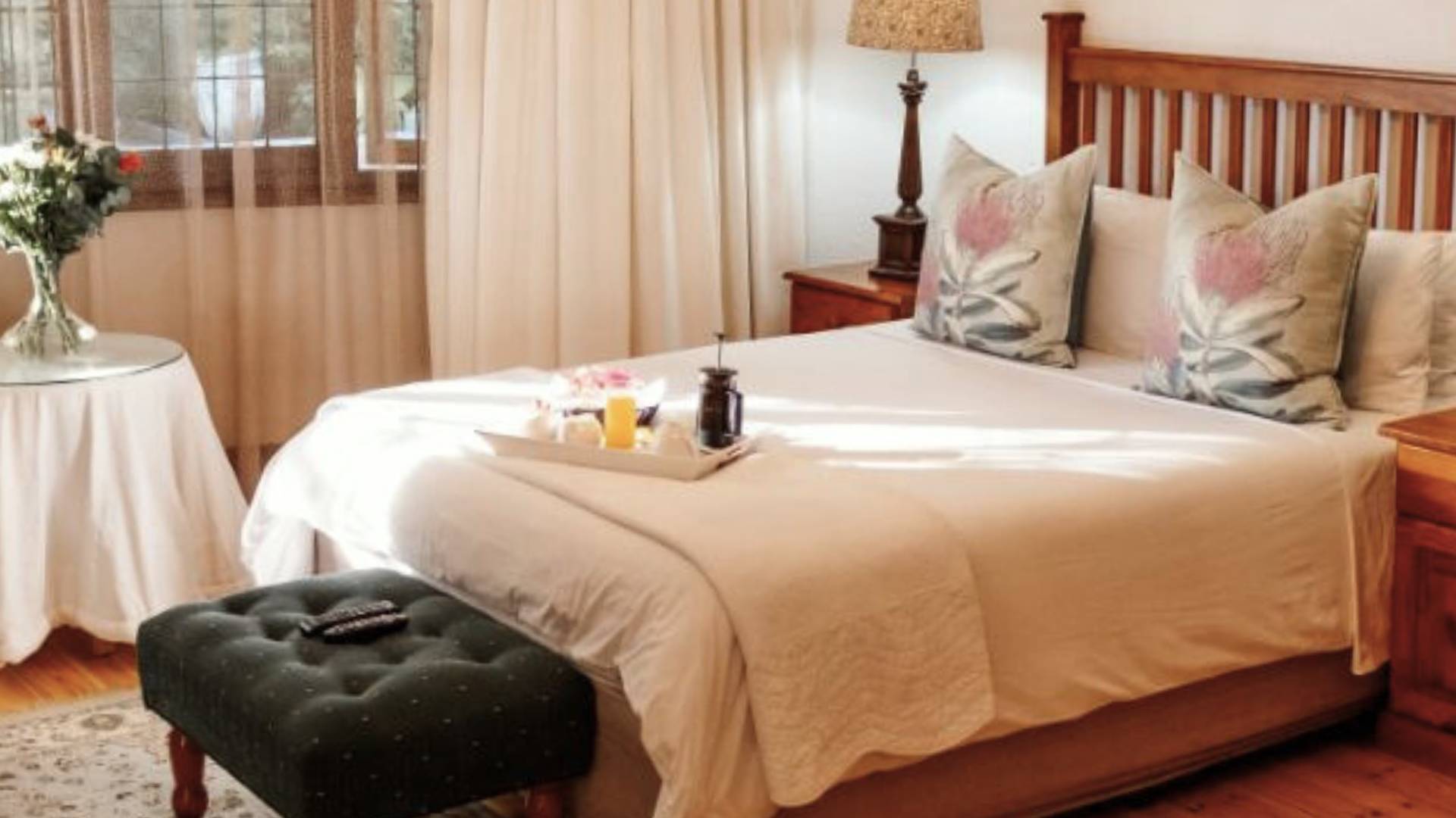 Deluxe Room queen bed and dressing table